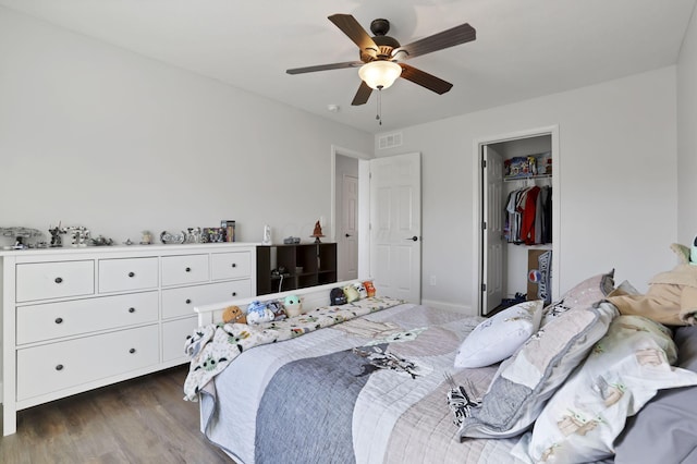 bedroom with ceiling fan, dark wood-style flooring, and visible vents