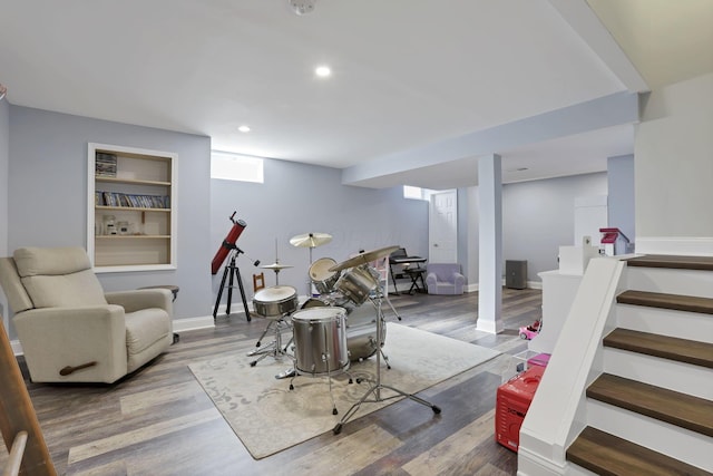 game room featuring baseboards, wood finished floors, and recessed lighting