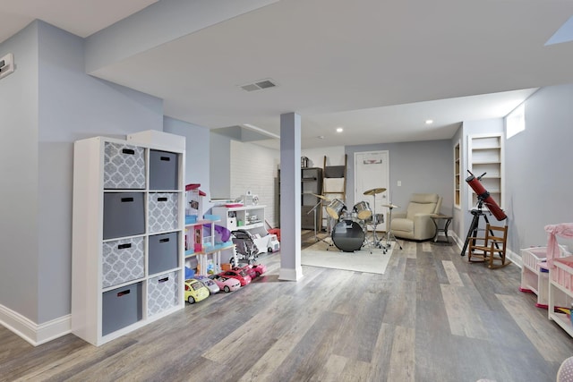 playroom featuring recessed lighting, visible vents, baseboards, and wood finished floors