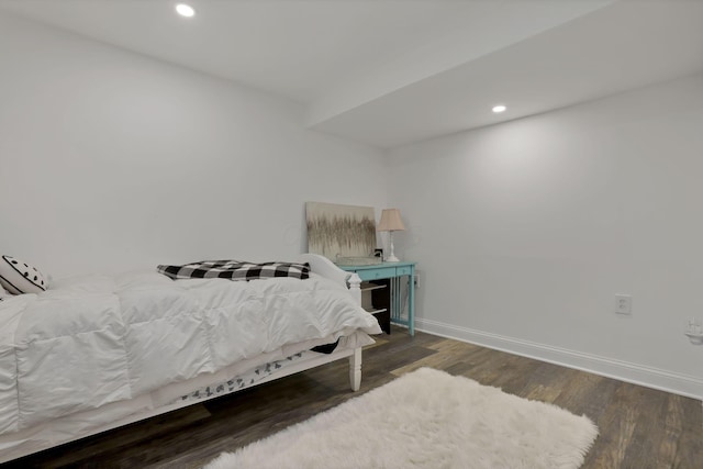 bedroom featuring baseboards, wood finished floors, and recessed lighting