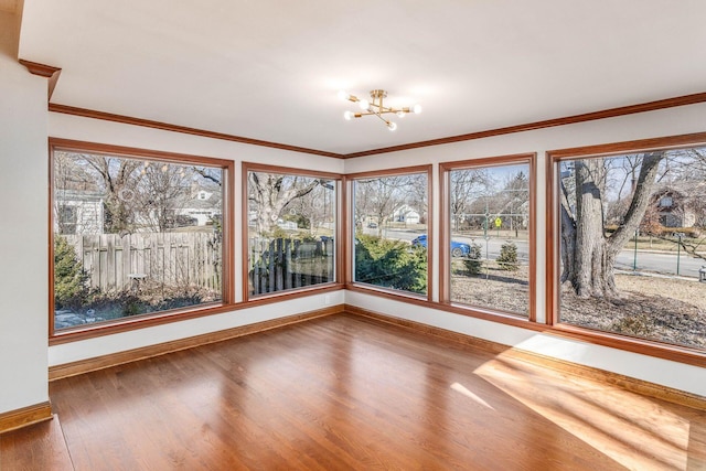 unfurnished sunroom with a notable chandelier