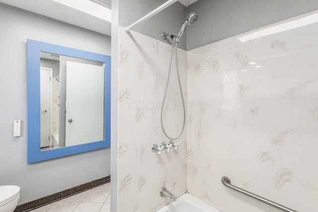 bathroom with toilet, shower / washtub combination, and tile patterned floors