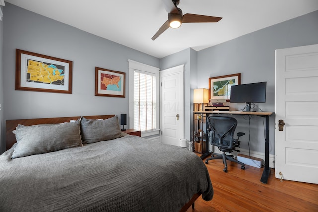 bedroom with wood finished floors and ceiling fan