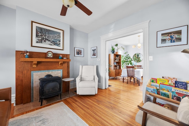 sitting room featuring a ceiling fan and wood finished floors