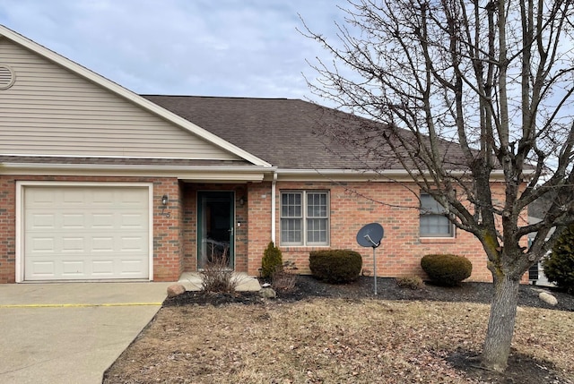 view of front of property featuring brick siding and a shingled roof