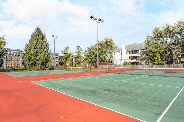 view of sport court featuring fence