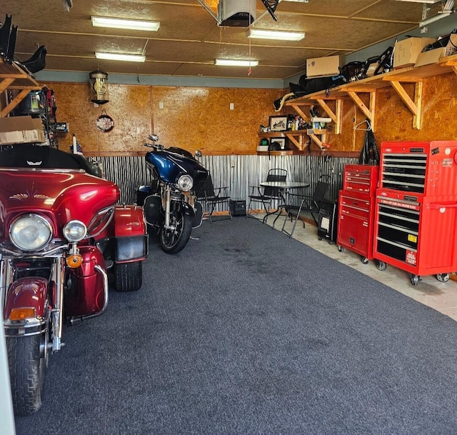 garage featuring a workshop area and a garage door opener