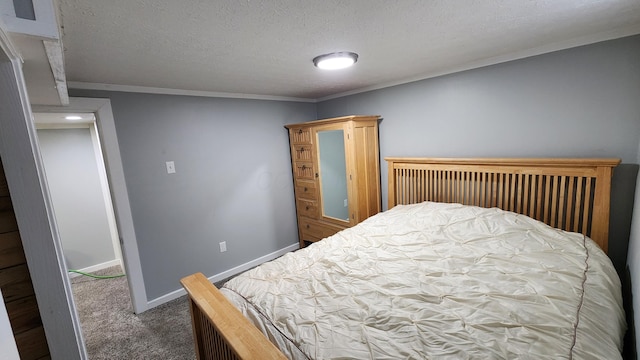 carpeted bedroom with a textured ceiling, crown molding, and baseboards