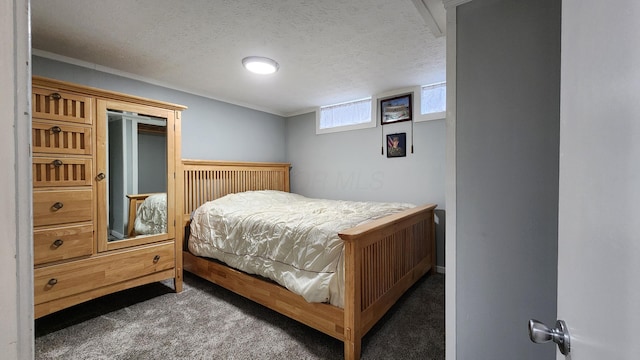 carpeted bedroom with a textured ceiling