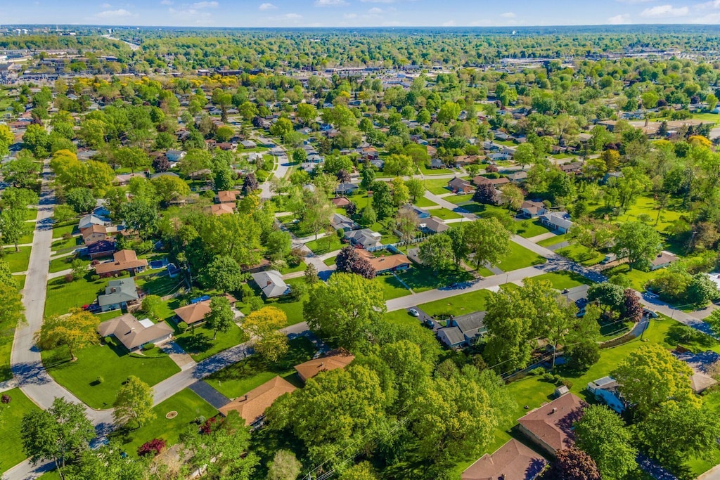 birds eye view of property with a residential view