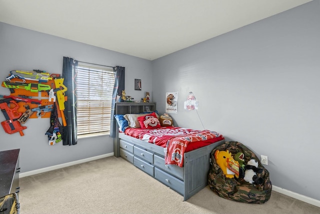 bedroom featuring carpet floors and baseboards