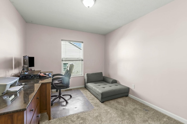 office with light carpet and baseboards