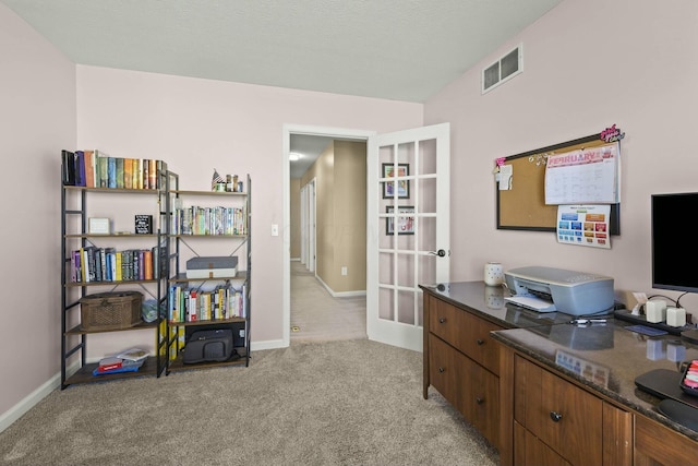 office featuring light carpet, baseboards, visible vents, and french doors