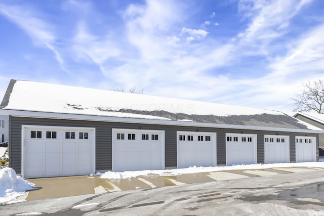 view of snow covered garage