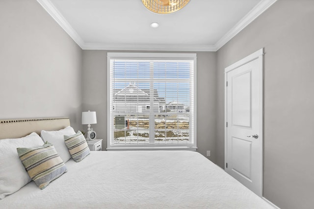 bedroom featuring multiple windows and crown molding