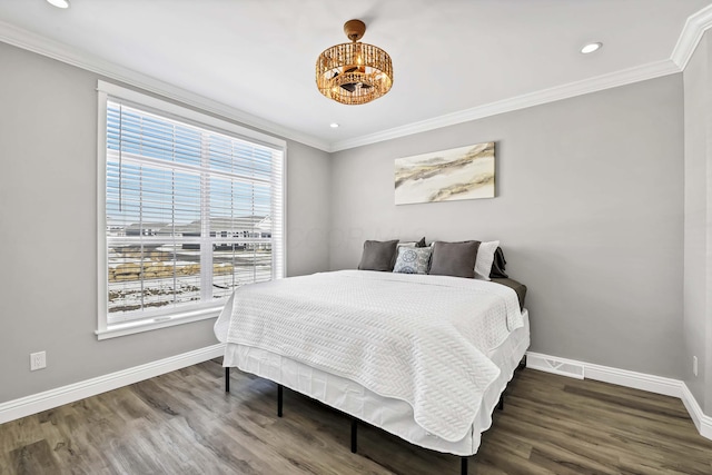 bedroom with crown molding and baseboards