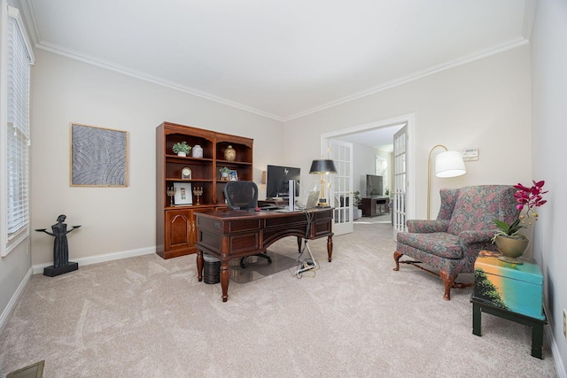 office area with visible vents, light colored carpet, baseboards, and ornamental molding