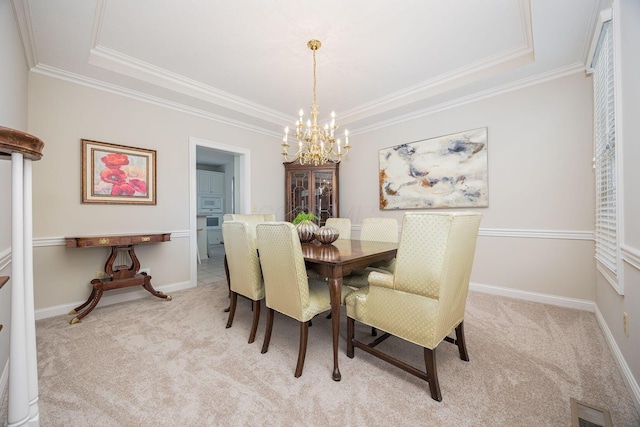 dining space with an inviting chandelier, crown molding, visible vents, and light carpet