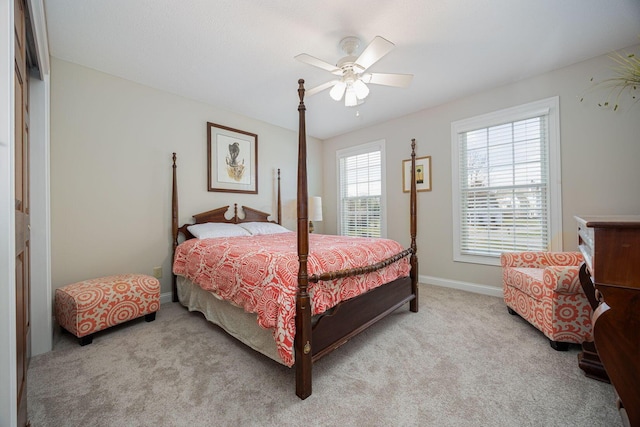 carpeted bedroom featuring a ceiling fan and baseboards