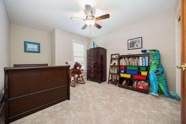 bedroom with baseboards, carpet floors, and a ceiling fan