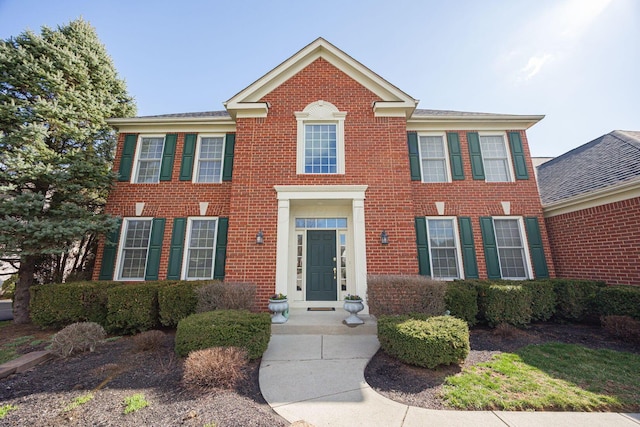 view of front of house featuring brick siding