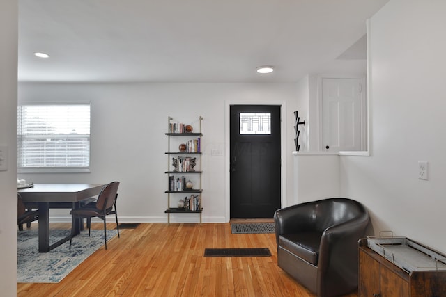 foyer featuring a healthy amount of sunlight, light wood-style floors, baseboards, and recessed lighting