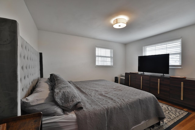 bedroom with wood finished floors