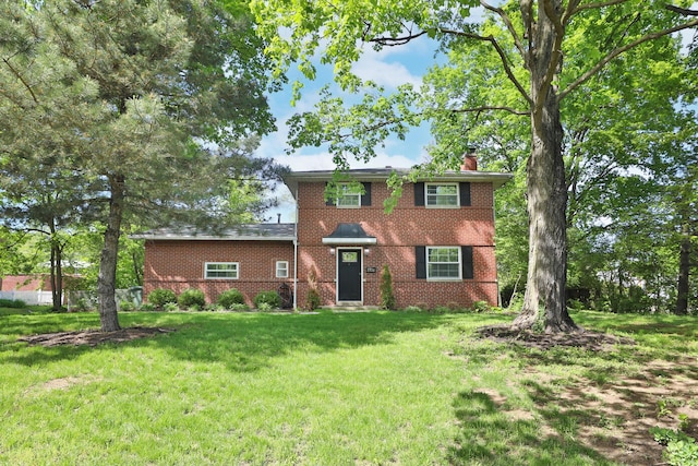 2938 Sherwood Rd, Columbus, OH 43209 - view of front facade with a chimney, a front yard, and brick siding