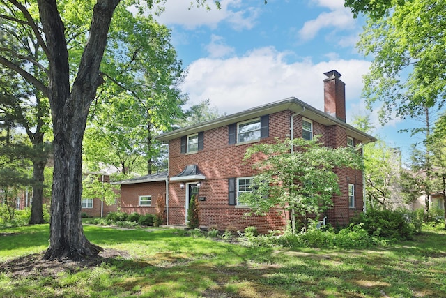 2938 Sherwood Rd, Columbus, OH 43209 - view of front of house featuring brick siding, a chimney, and a front lawn