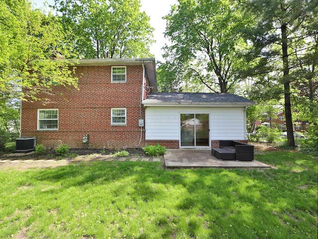 2938 Sherwood Rd, Columbus, OH 43209 - rear view of house with a patio area, a lawn, central AC unit, and brick siding