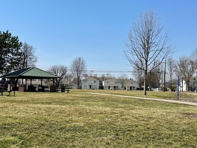 view of home's community with a gazebo, a yard, and a carport