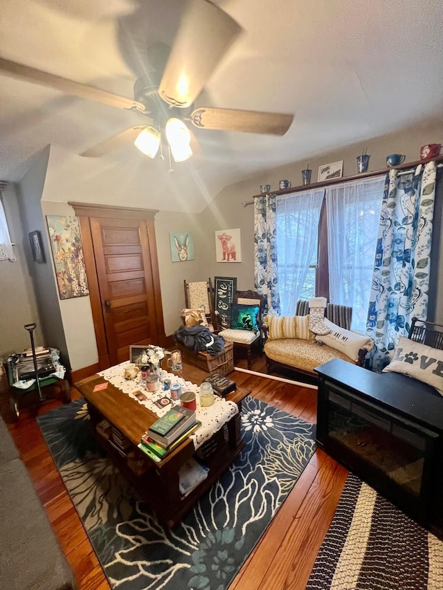 living area featuring ceiling fan and wood finished floors