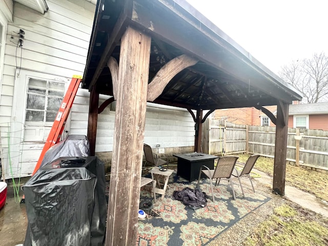 view of patio / terrace featuring fence