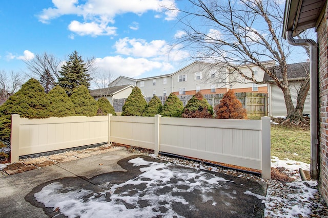 view of patio / terrace with a fenced backyard and a residential view