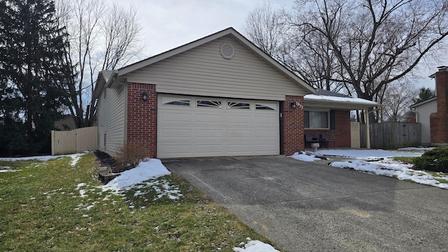 single story home with a garage, a gate, concrete driveway, and brick siding