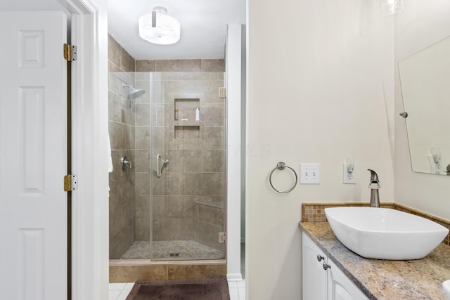 full bath featuring a shower stall and vanity