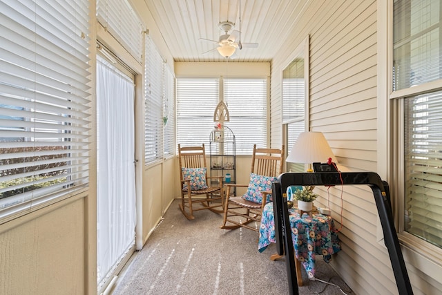 sunroom / solarium featuring ceiling fan