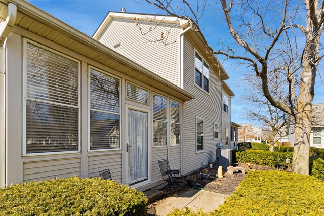 view of property exterior with central AC