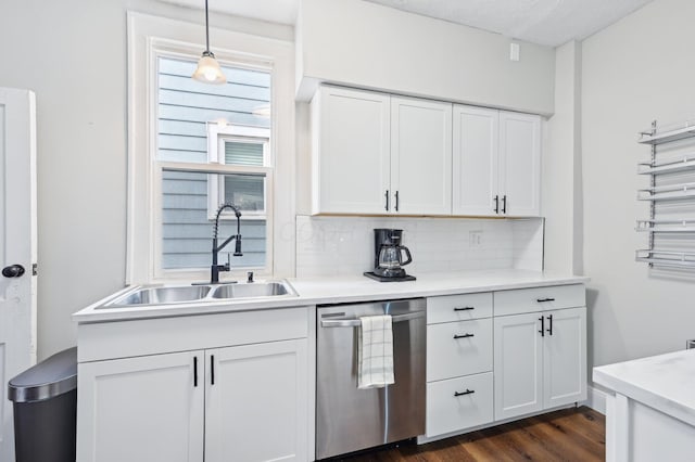 kitchen featuring a sink, white cabinetry, light countertops, decorative backsplash, and dishwasher