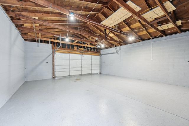 garage featuring concrete block wall