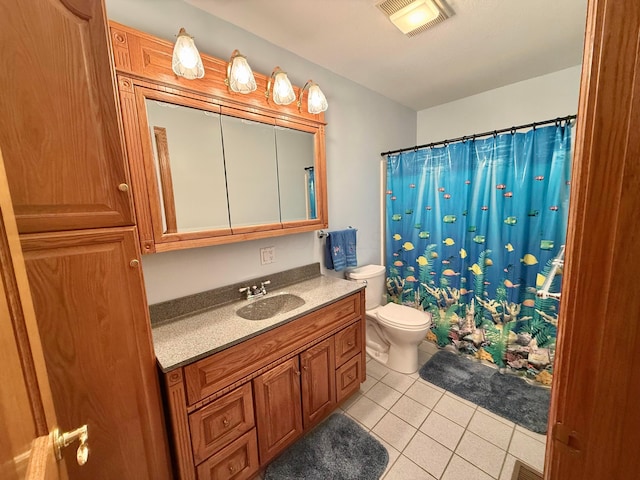 bathroom featuring tile patterned flooring, visible vents, curtained shower, toilet, and vanity