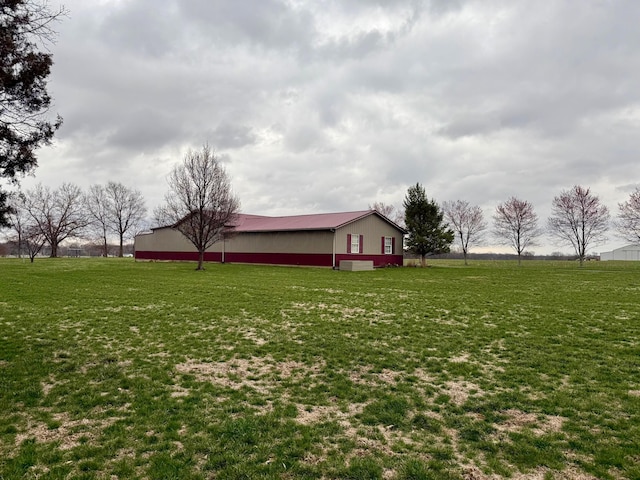 view of yard featuring an outbuilding and an outdoor structure
