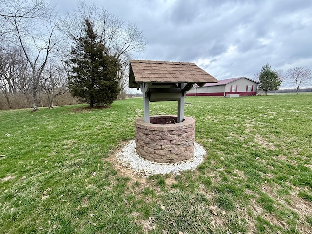 view of yard with an outdoor fire pit