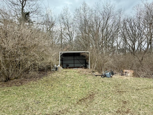 view of yard featuring an outbuilding and a pole building