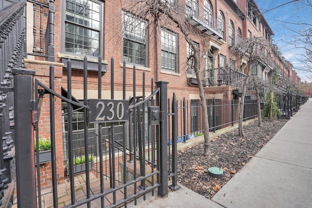 view of building exterior with fence