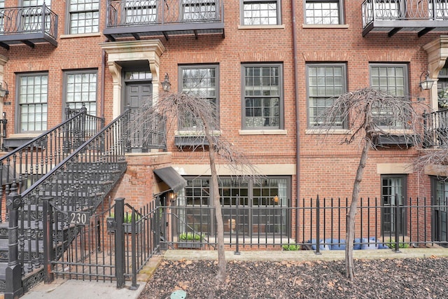 view of building exterior with fence