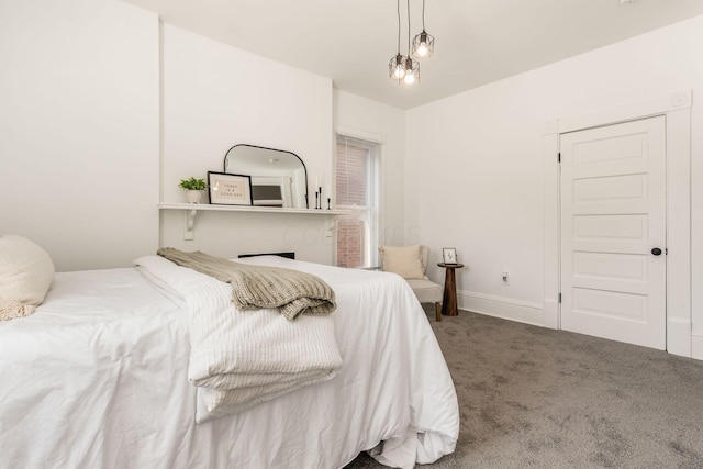 bedroom with carpet and baseboards