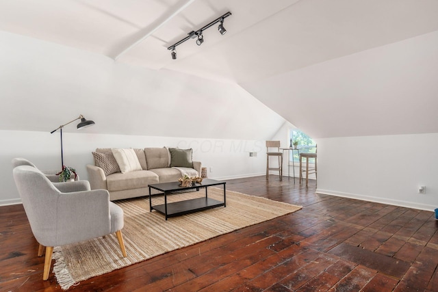 living area featuring rail lighting, baseboards, vaulted ceiling, and dark wood-style flooring