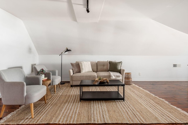 living room with baseboards, visible vents, wood finished floors, vaulted ceiling, and track lighting