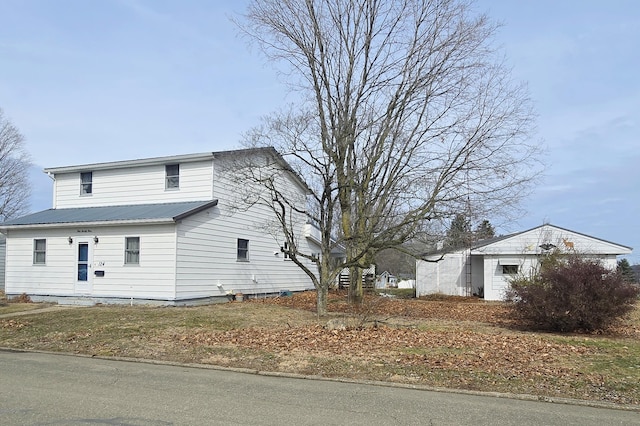 view of property exterior featuring metal roof